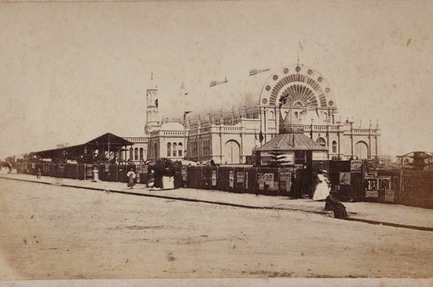 Exterior photograph of the exhibiton Building and fence at Prince Alfred Park, 1870.