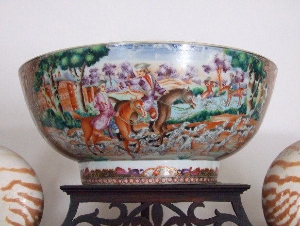 Colourful punch bowl depicting 2 people on horses in a rural landscape.