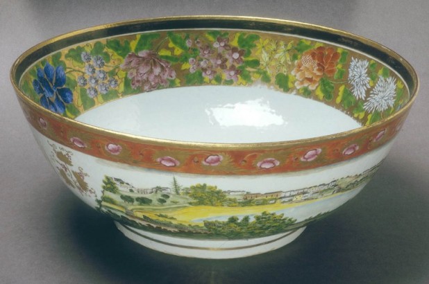 Various tyes of flowers decorate the inside rim of the punchbowl, with a scene depicting Sydney Cove on the outside.