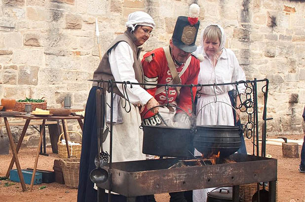 Cooking over the fire at 'Redcoats and Convicts' at the Hyde Park Barracks.