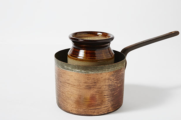 Copper saucepan and ceramic jar.