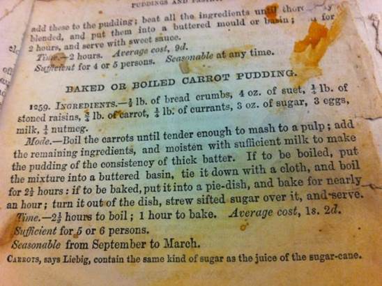 Mrs Beeton's carrot pudding showing splodges of orange on the page.