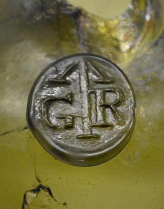 Embossed seal from a glass bottle found at Rouse Hill House and Farm