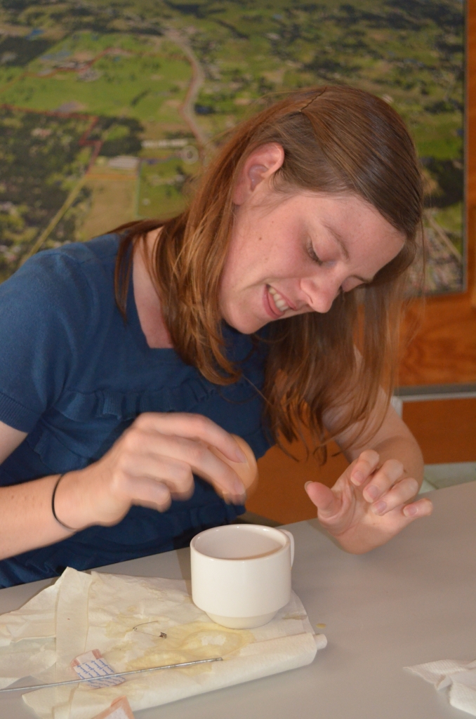 Blowing eggs for display in the Eat Your History: A Shared Table exhibition