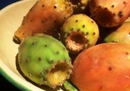 prickly pear fruit (needles removed) in an enamel bowl